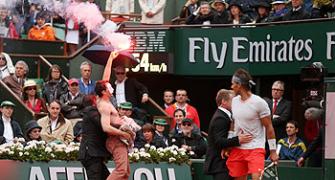Protestor with a flare interrupts French Open final