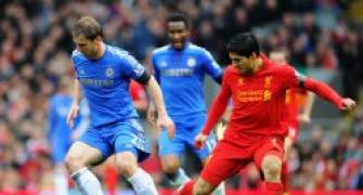 Suarez admits 'bout of temper' caused 'biting' incident