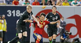 Spain beat Ireland 2-0 with two late goals