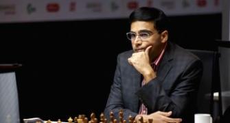 Anand crushes Topalov, moves to joint second