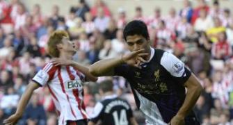 Suarez nets two on League return as Liverpool win