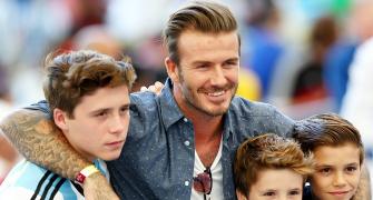 Soccer star Beckham and son 'shaken' after car crash