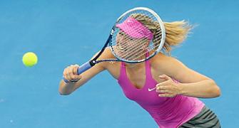 Sharapova fights back against Estonian, to meet Serena in Brisbane semis