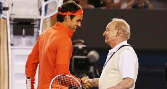 PHOTOS: Federer trades shots with hero Rod Laver for charity