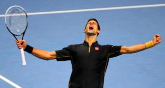 Djokovic trounces Berdych at Tour Finals, seals No.1 spot