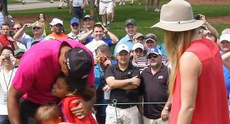 PHOTOS: Tiger Woods with his two adorable caddies