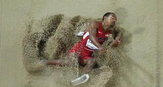 PHOTOS: Taylor wins triple jump gold with second-longest ever leap