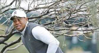 WOUNDED Tiger quits again; Thompson tops at Torrey Pines