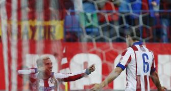 Atletico use their heads to turn up heat on Real