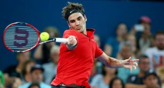 Rusty Federer scrapes through to win season debut