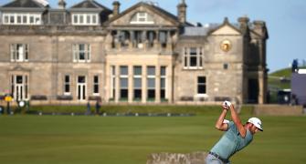 British Open: Leader Johnson holds firm; Woods misses cut