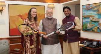 Paes, Hingis present PM Modi with autographed racquets