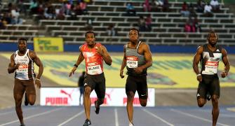 Blake completes Jamaican sprint double in Bolt's absence