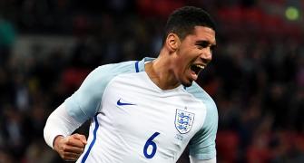 PHOTOS: Smalling smiling after England sink Portugal
