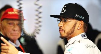 Australian Grand Prix: Hamilton quickest, Rosberg crashes in rain