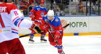 PHOTOS: Putin shows off ace stick skills in all-star ice hockey game