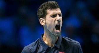 PHOTOS: Djokovic digs deep to repel Raonic onslaught
