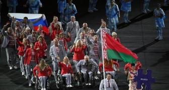 Belarus delegate carries Russian flag during Rio opening ceremony