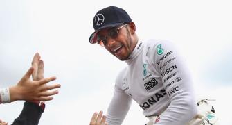 Hamilton marks 200th race with victory in Belgium
