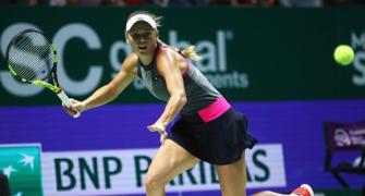 WTA Finals: Dominant Wozniacki swats aside Halep