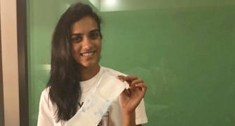 Sindhu, Shastri, Geeta pose with sanitary pad