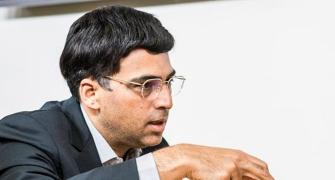 Anand plays out easy draw with Carlsen