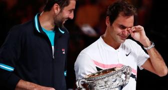 Weeping Federer hails 20th Grand Slam title