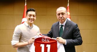 German soccer star Ozil defends photo with Erdogan