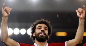 Liverpool's Salah extends stay at Anfield