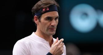 Federer begins road to 100 with a win in Paris