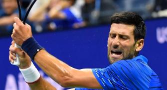 US Open PICS: Djokovic, Federer through; Venus exits