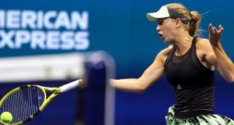 PIX: Wozniacki safely into third round; Halep shocked
