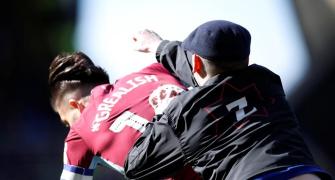 Aston Villa's Grealish is PUNCHED by pitch invader in derby win