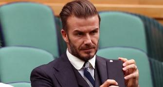 Beckham gets six-month driving ban for using phone