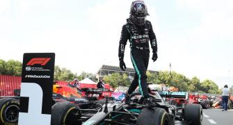 Dazed Hamilton takes dominant win in Spain