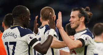 EPL PIX: Spurs up to second; Gunners beat United
