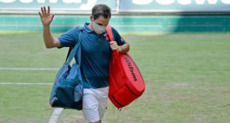 Federer loses to Auger-Aliassime in Halle