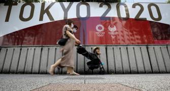 Tokyo 2020 bans booze, high-fives to curb COVID