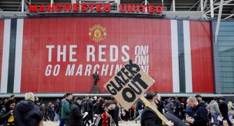 Man United-Liverpool tie postponed as fans storm pitch