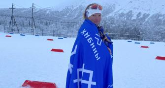 Banned Belarusian skier flees country