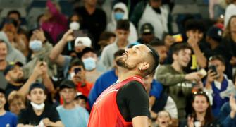 Showman Kyrgios goes from sick-bed to second round