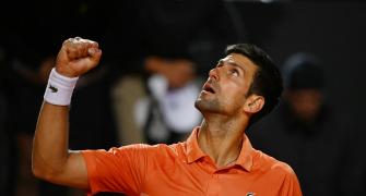 Djokovic keeps top spot after beating Auger-Aliassime