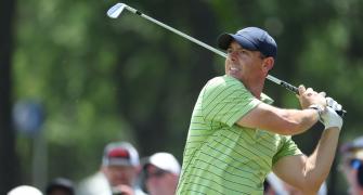 PGA Championship: McIlroy grabs lead as Woods falters