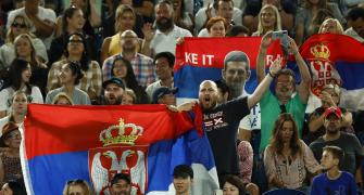 Djokovic's dad seen with fans carrying Russia flags