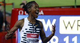Shocked Kipyegon breaks 5,000m world record