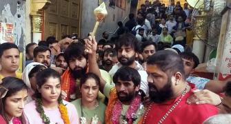Protesting wrestlers march to Hanuman temple