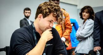 What is Carlsen doing on a bike at Chess Olympiad?