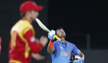 PHOTOS: Raina ton stretches India's unbeaten run in World Cup