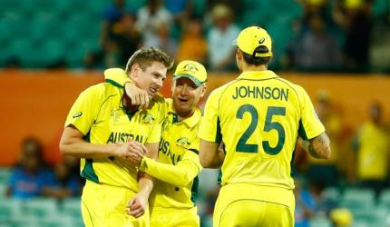 Australia knock defending champs India out of World Cup