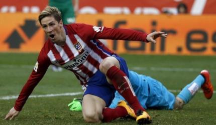 Torres reaches century, Atletico keep pressure on Barca